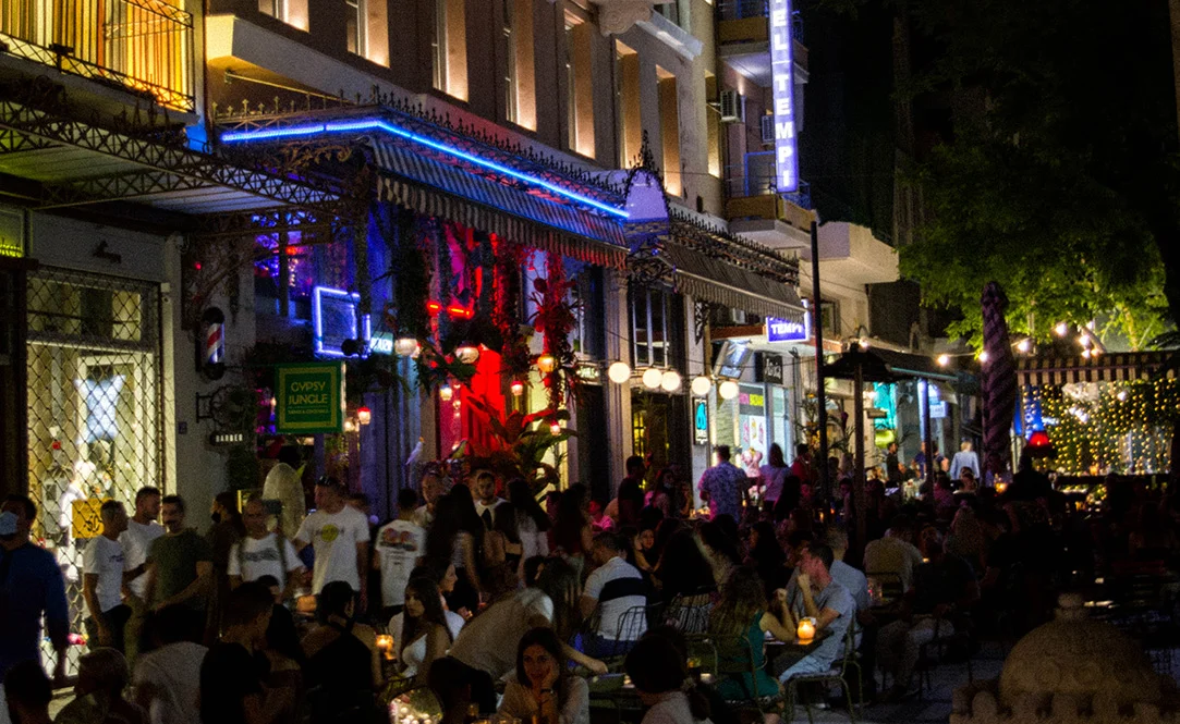 Nightlife in the city of Athens. Young locals eating and drinking out