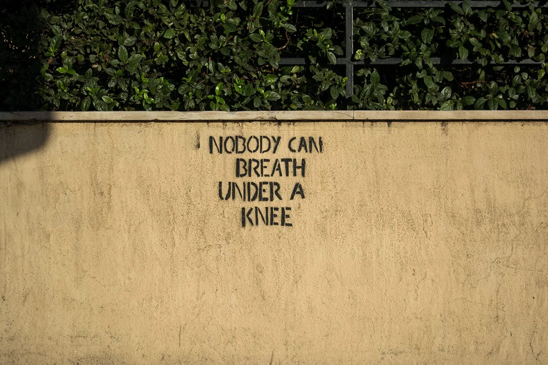 Nobody can breath under a knee, graffiti on a wall in Athens, Greece