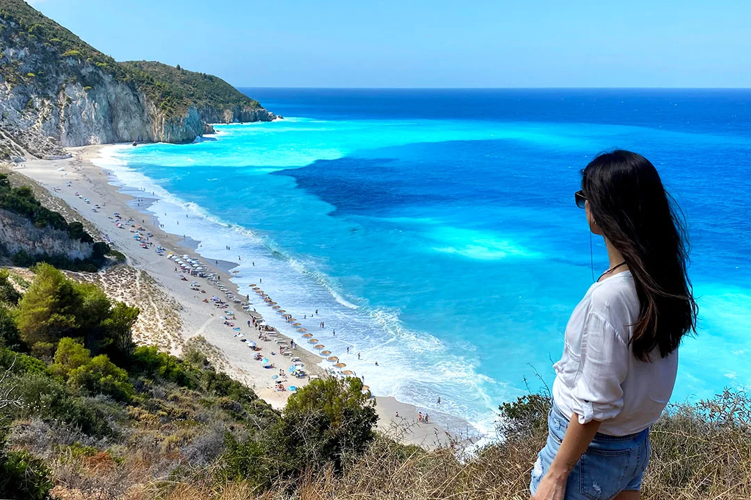Woman enjoying the view of Mylos beach at Lefkas Island in Greece